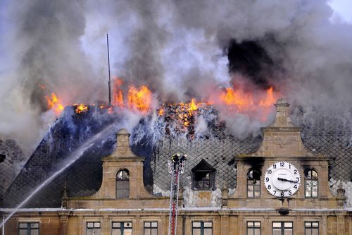 Fire fighters try to extinguish a fire at The Haydarpasa station in Istanbul